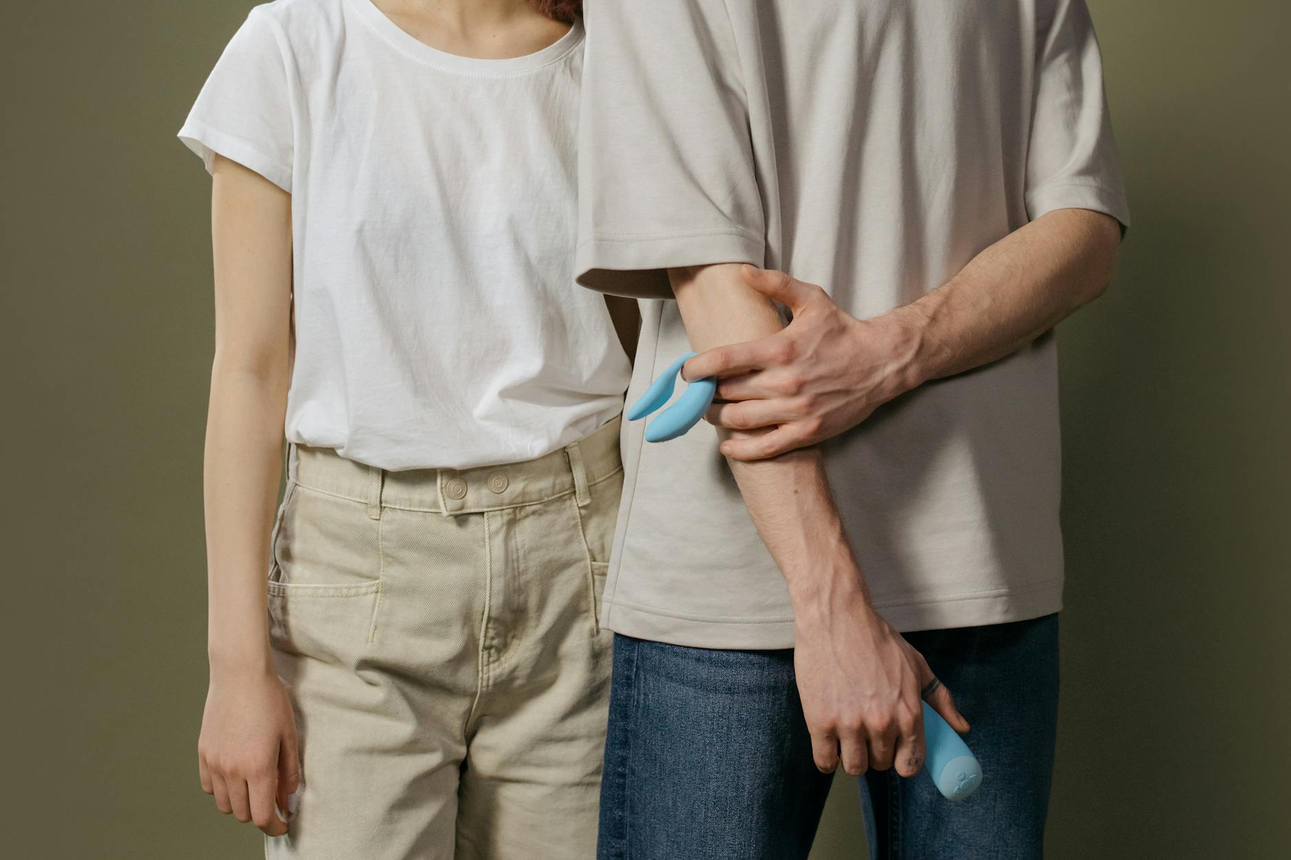 A couple standing together indoors, exploring intimacy with intentionality and communication